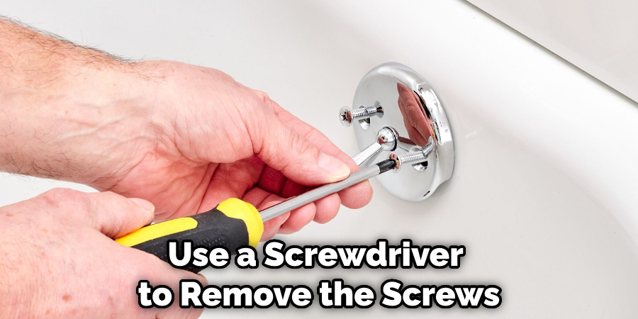 Use a Screwdriver to Remove the Screws