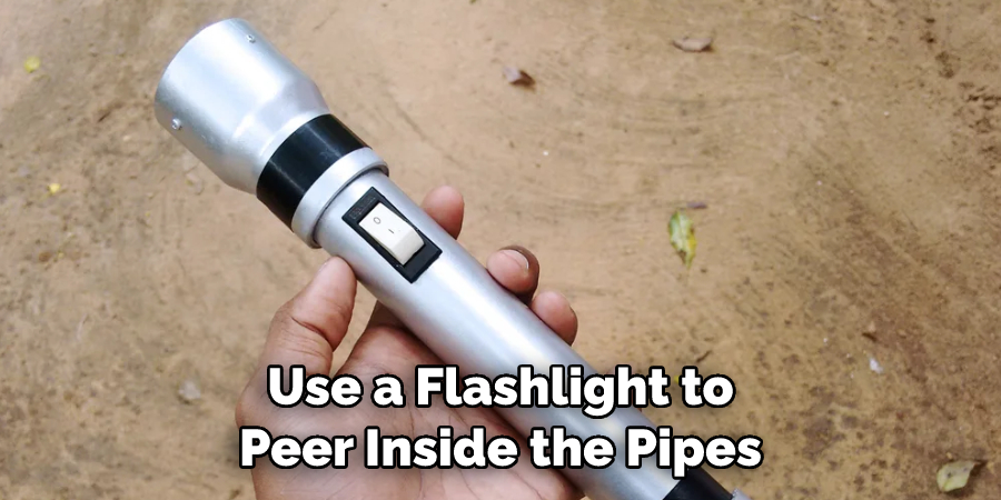 Use a Flashlight to Peer Inside the Pipes