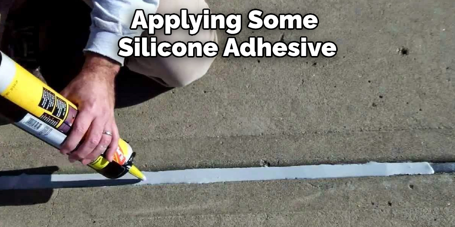 Applying Some Silicone Adhesive