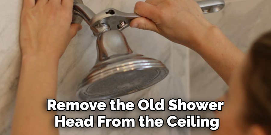 Remove the Old Shower Head From the Ceiling