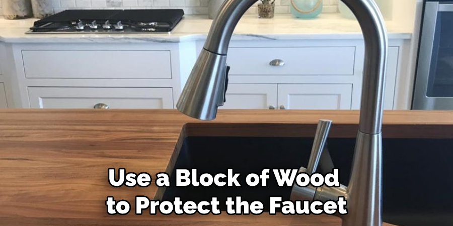 Use a Block of Wood to Protect the Faucet