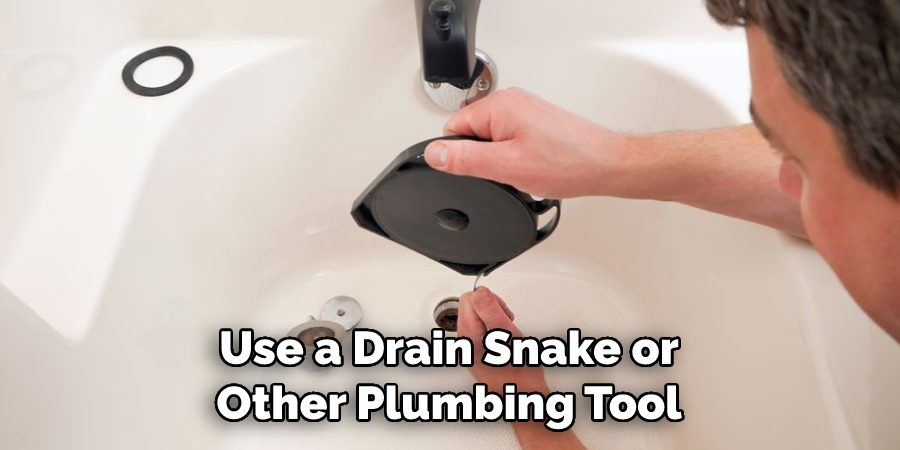 Use a Drain Snake or Other Plumbing Tool