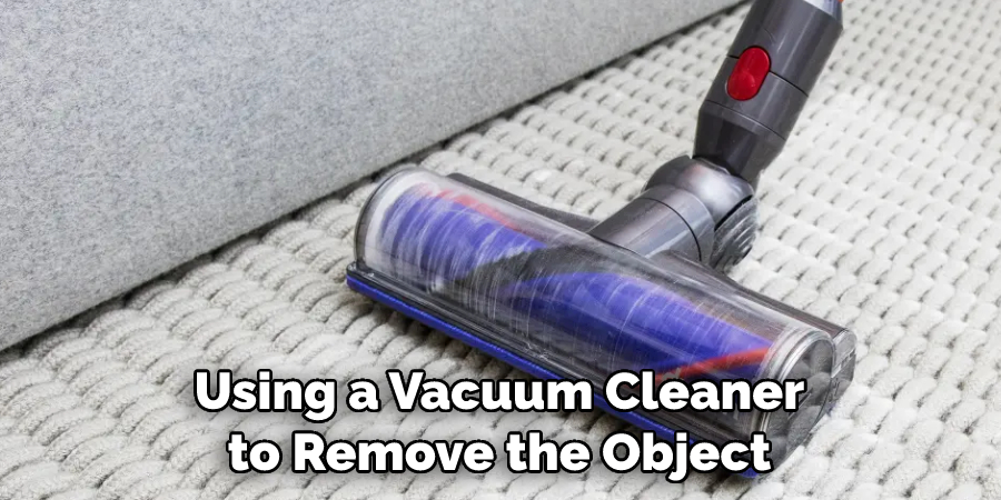 Using a Vacuum Cleaner to Remove the Object