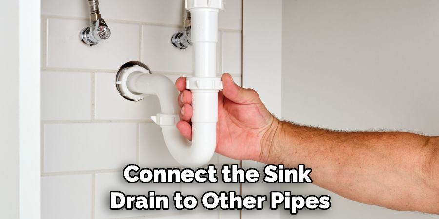 Connect the Sink Drain to Other Pipes