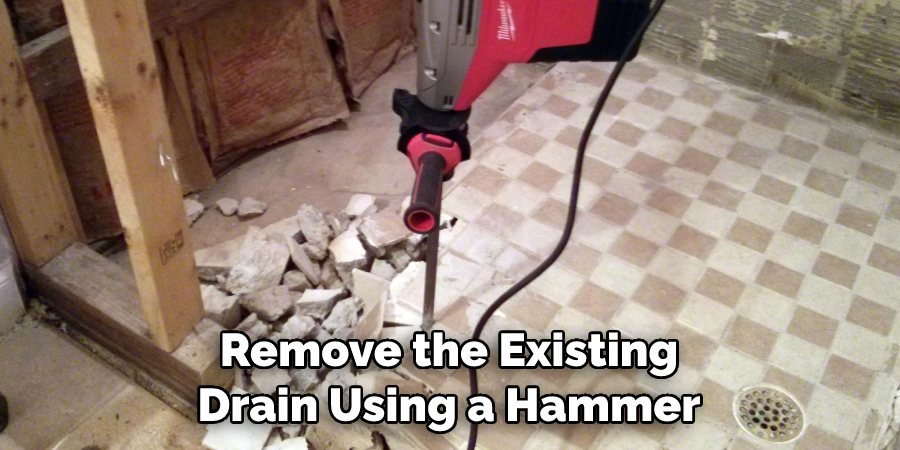 Remove the Existing Drain Using a Hammer