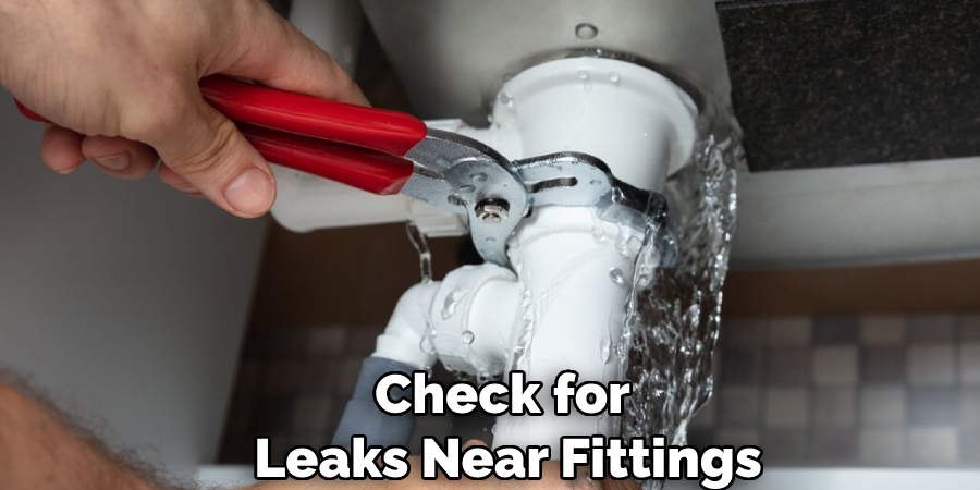 Check for Leaks Near Fittings