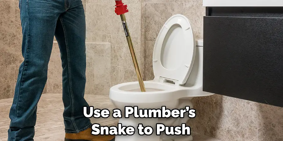 Use a Plumber’s Snake to Push