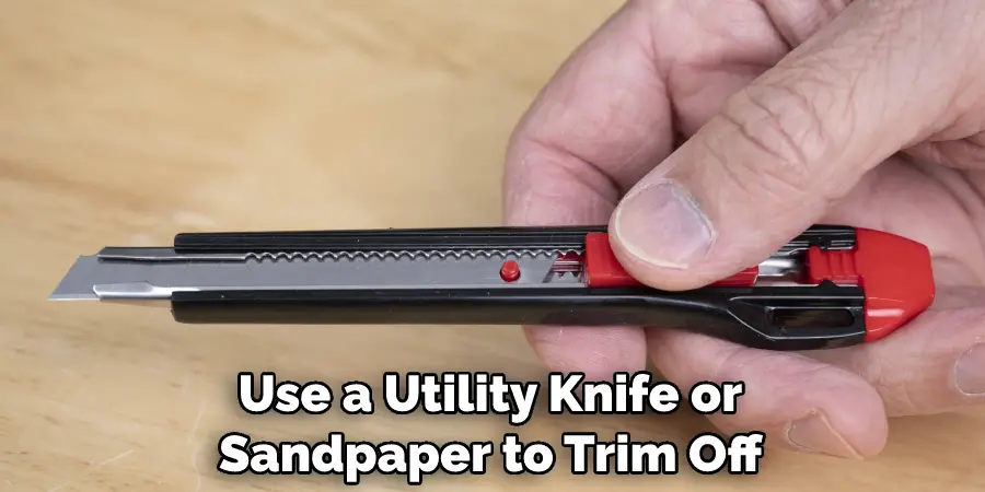 Use a Utility Knife or Sandpaper to Trim Off