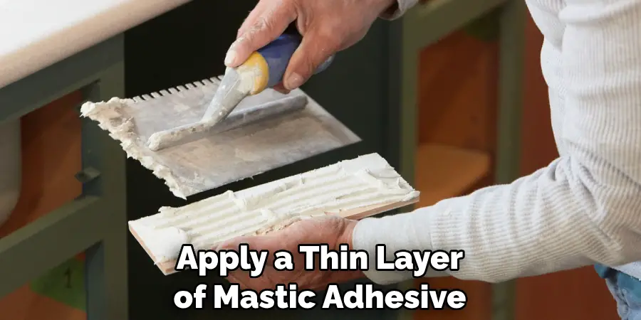 Apply a Thin Layer of Mastic Adhesive