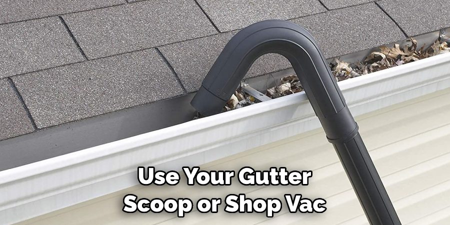 Use Your Gutter Scoop or Shop Vac