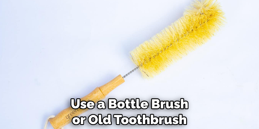 Use a Bottle Brush or Old Toothbrush