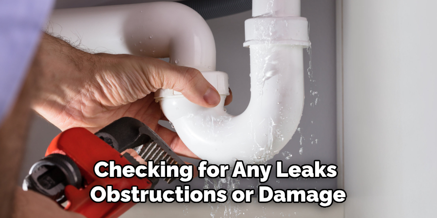 Checking for Any Leaks Obstructions or Damage
