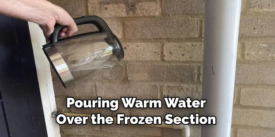 Pouring Warm Water Over the Frozen Section