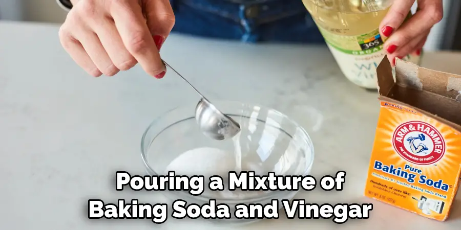 Pouring a Mixture of Baking Soda and Vinegar