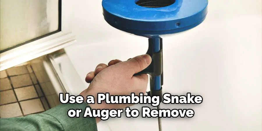 Use a Plumbing Snake or Auger to Remove