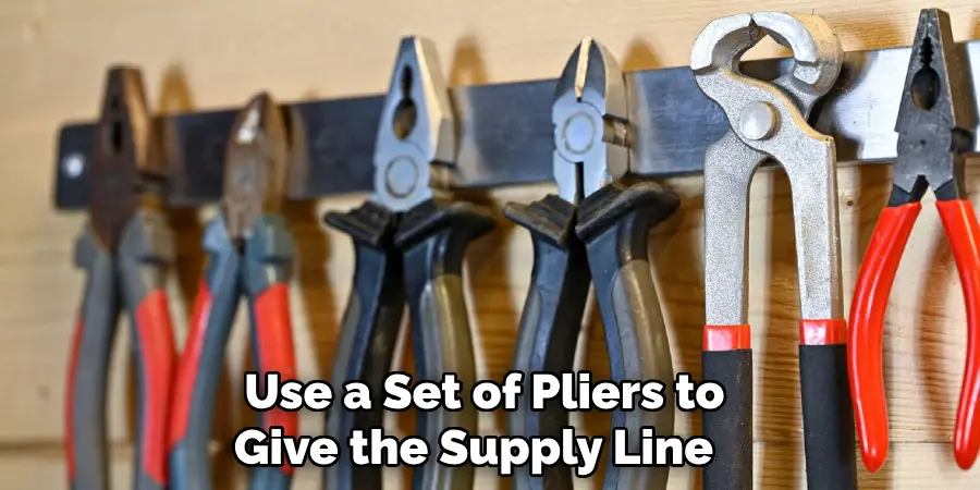  Use a Set of Pliers to Give the Supply Line 