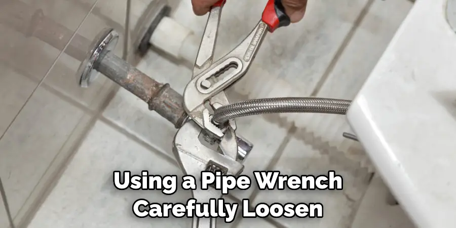 Using a Pipe Wrench Carefully Loosen