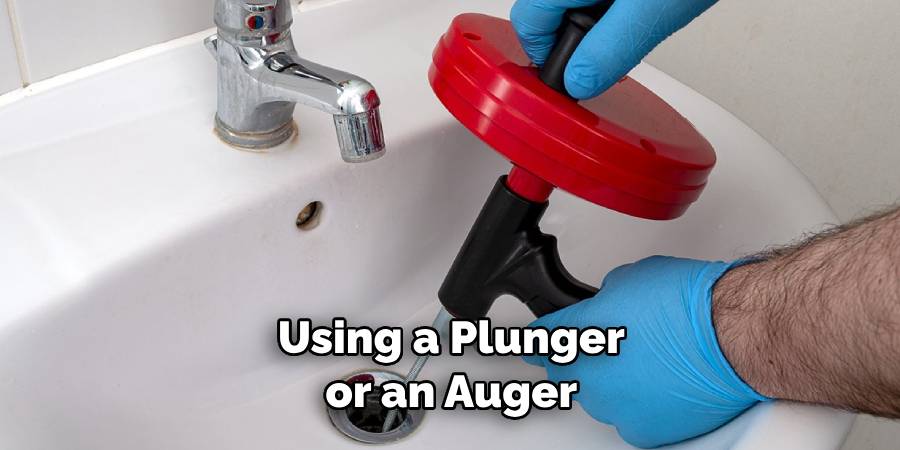 Using a Plunger or an Auger