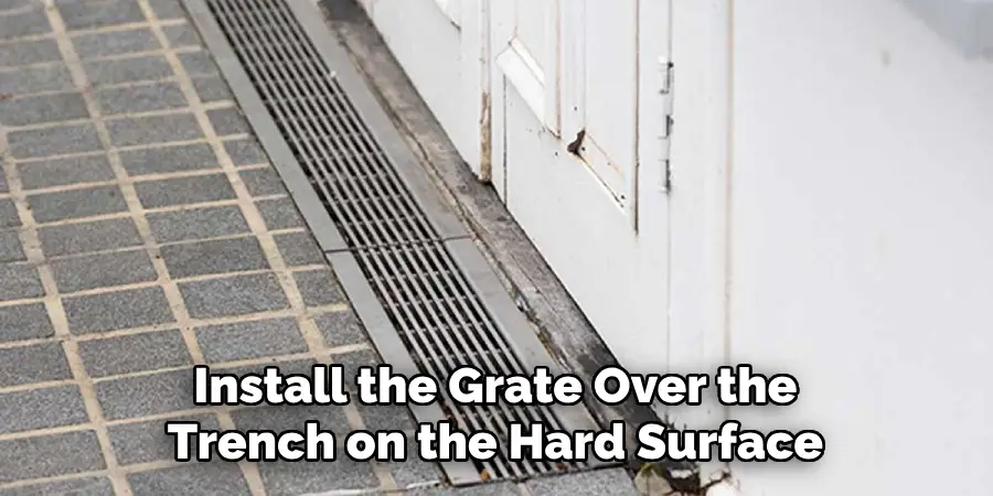 Install the Grate Over the Trench on the Hard Surface