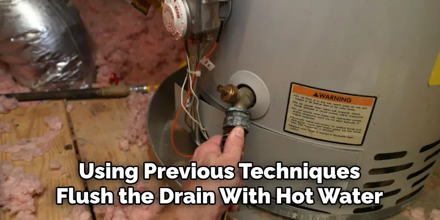 Using Previous Techniques Flush the Drain With Hot Water