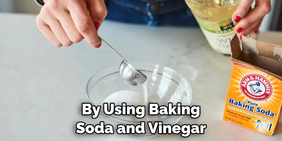 By Using Baking Soda and Vinegar
