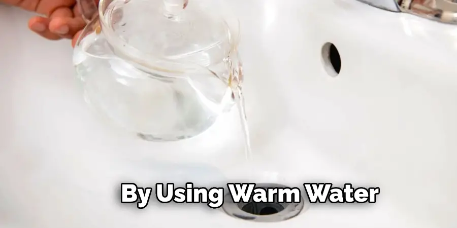 By Using Warm Water