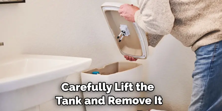 Carefully Lift the Tank and Remove It