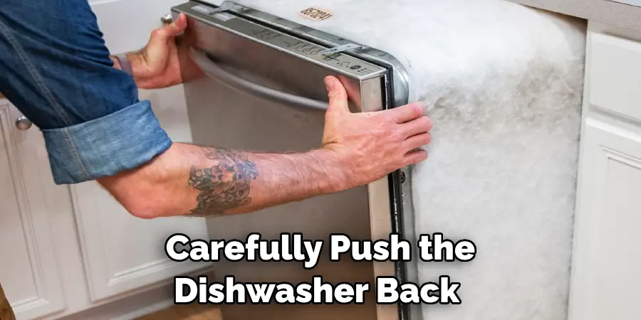 Carefully Push the Dishwasher Back 