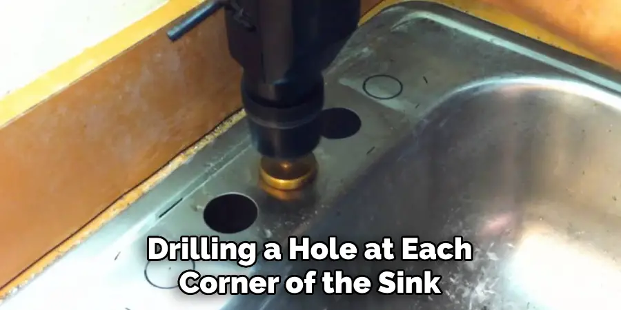 Drilling a Hole at Each Corner of the Sink