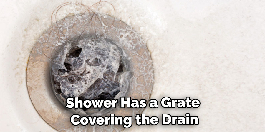Shower Has a Grate Covering the Drain