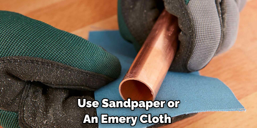 Use Sandpaper or An Emery Cloth