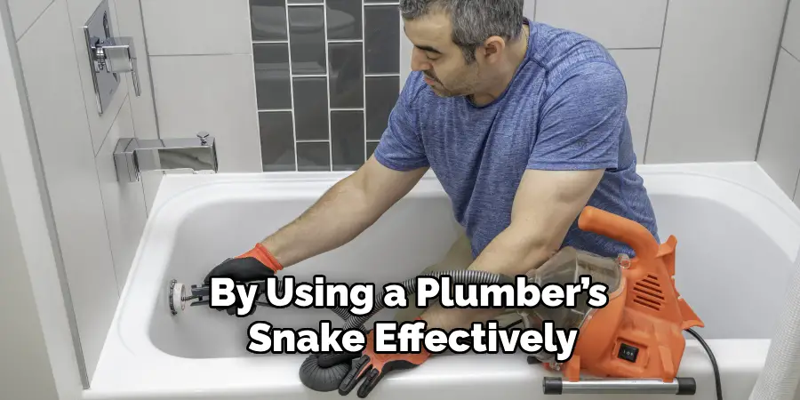 By Using a Plumber’s 
Snake Effectively