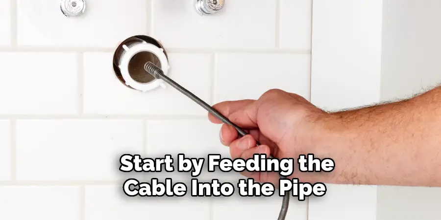 Start by Feeding the
Cable Into the Pipe