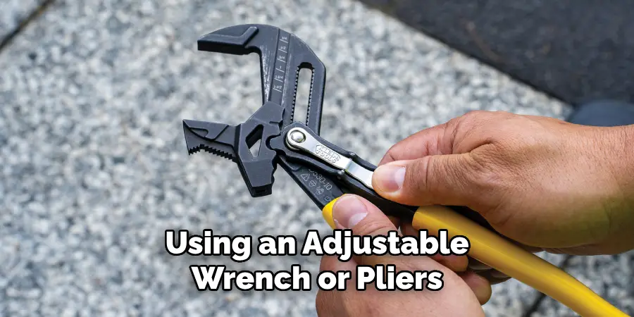 Using an Adjustable
Wrench or Pliers