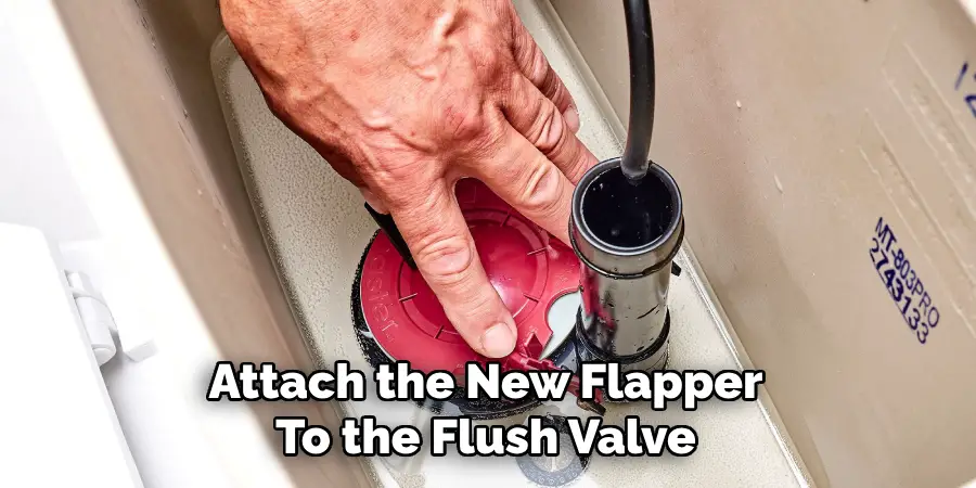 Attach the New Flapper
To the Flush Valve