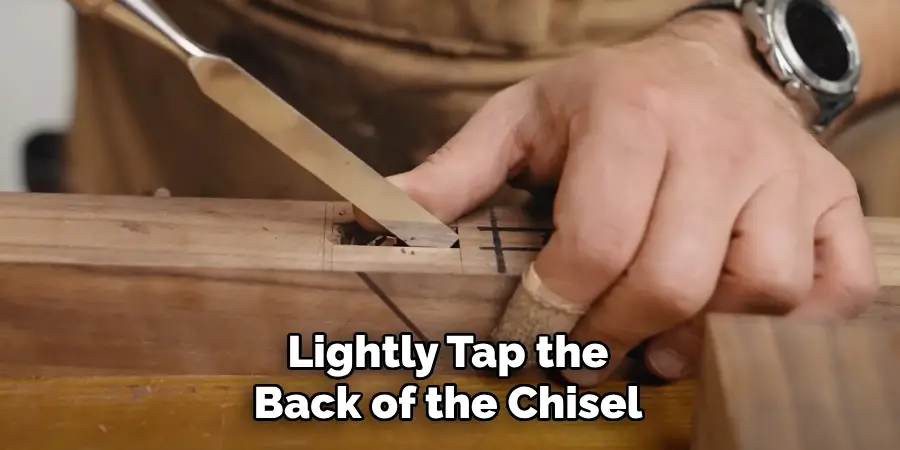 Lightly Tap the
Back of the Chisel