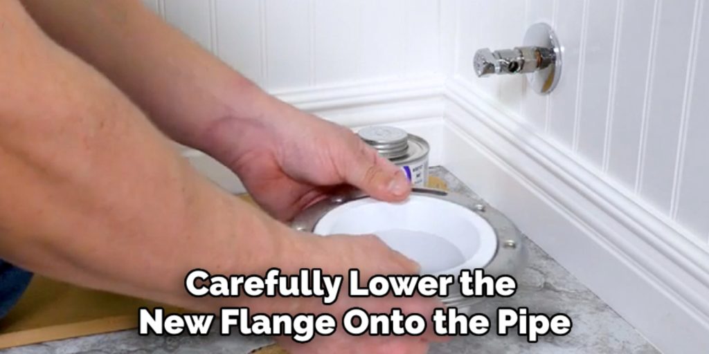 Carefully Lower the 
New Flange Onto the Pipe