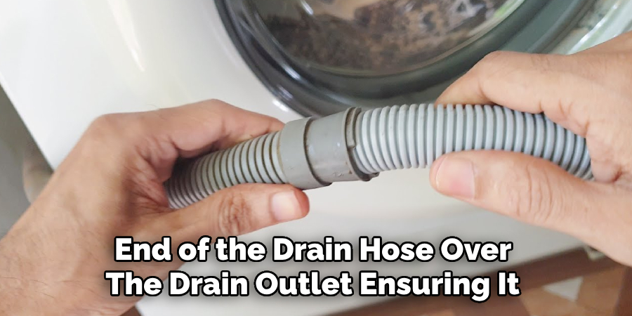 End of the Drain Hose Over
The Drain Outletn Ensuring It