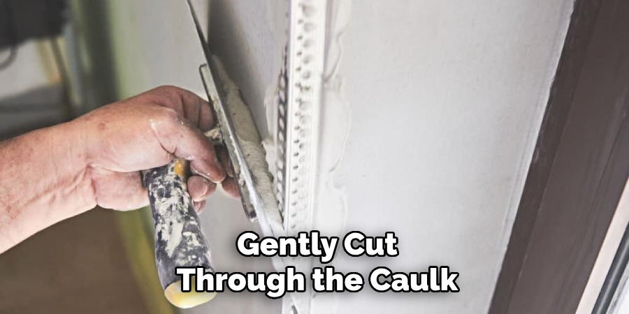 Gently Cut
Through the Caulk