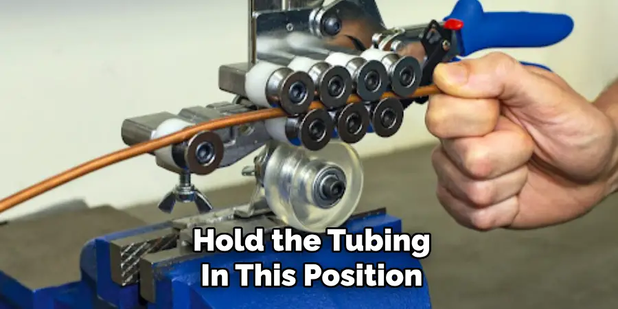 Hold the Tubing
In This Position