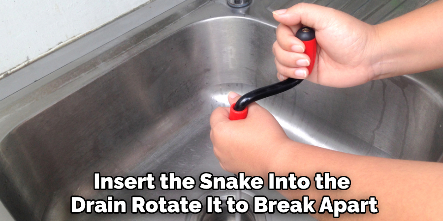 Insert the Snake Into the 
Drain Rotate It to Break Apart