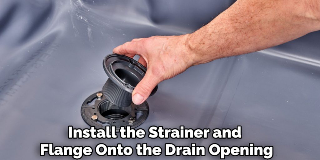 Install the Strainer and 
Flange Onto the Drain Opening