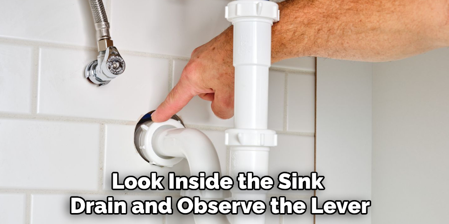 Look Inside the Sink 
Drain and Observe the Lever