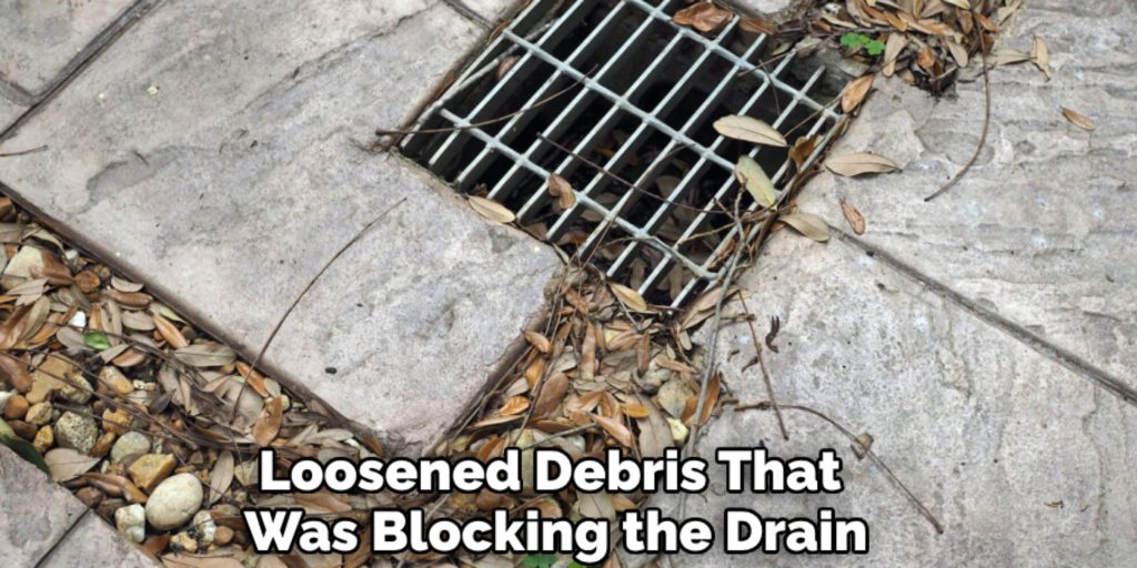 Loosened Debris That 
Was Blocking the Drain