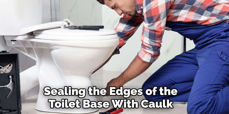 Sealing the Edges of the Toilet Base With Caulk 