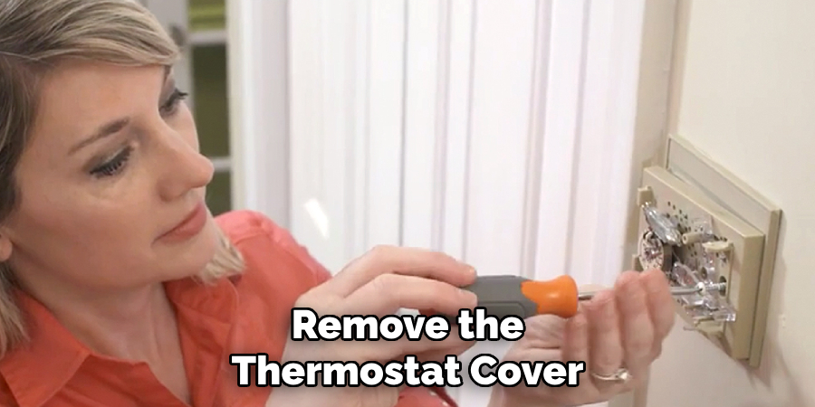 Remove the Thermostat Cover