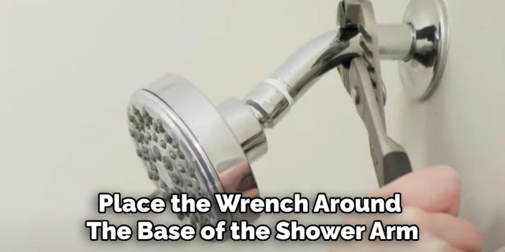 Place the Wrench Around 
The Base of the Shower Arm