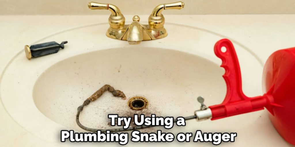 Try Using a 
Plumbing Snake or Auger