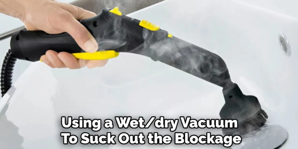 Using a Wet/dry Vacuum 
To Suck Out the Blockage