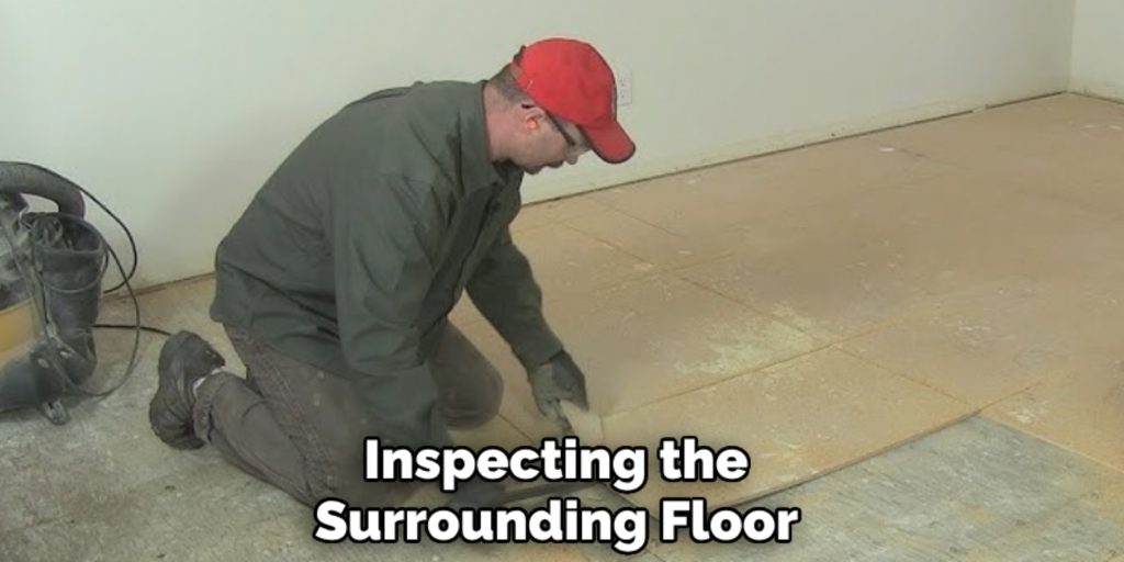 inspecting the surrounding floor and subfloor